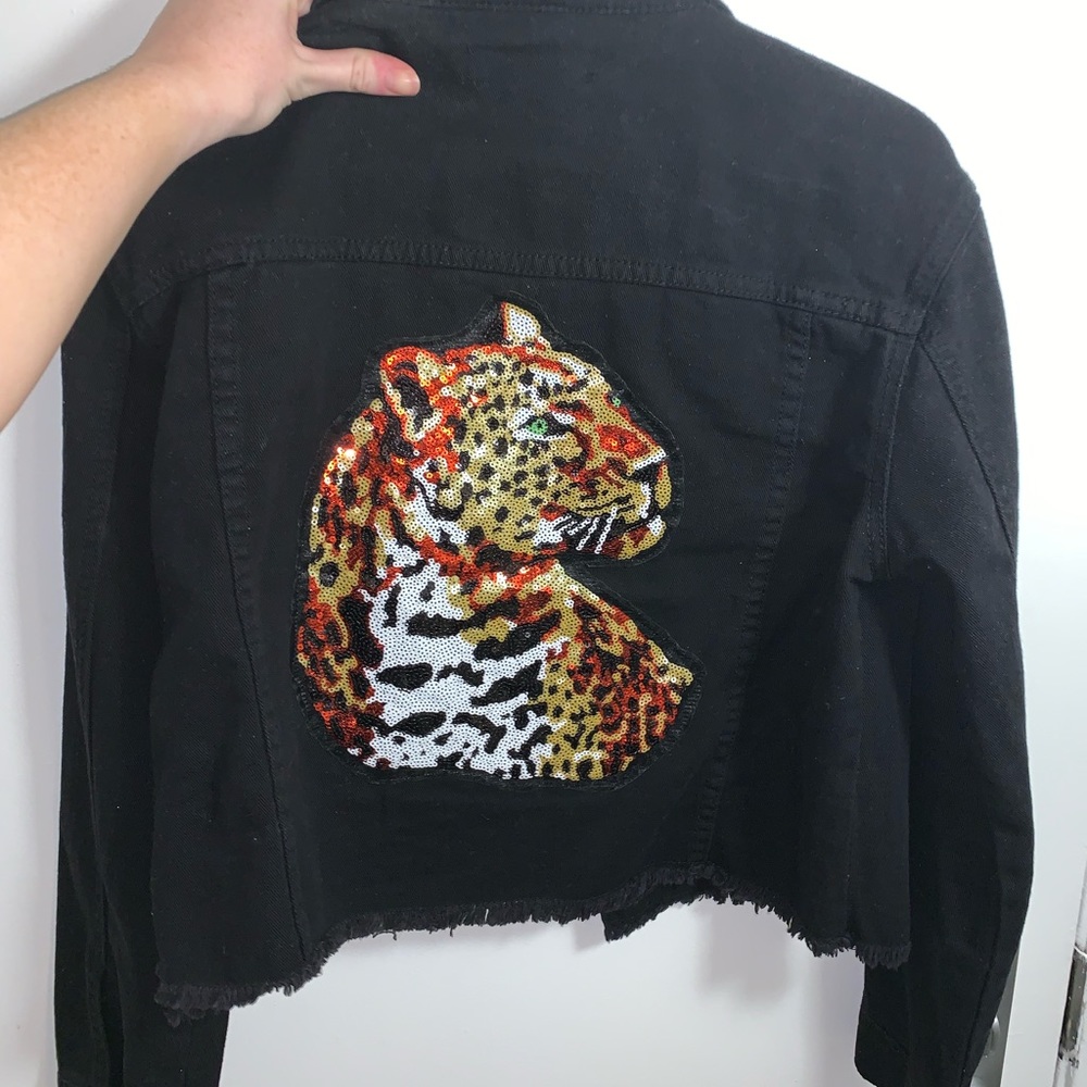 Black cropped denim jacket with detail on back